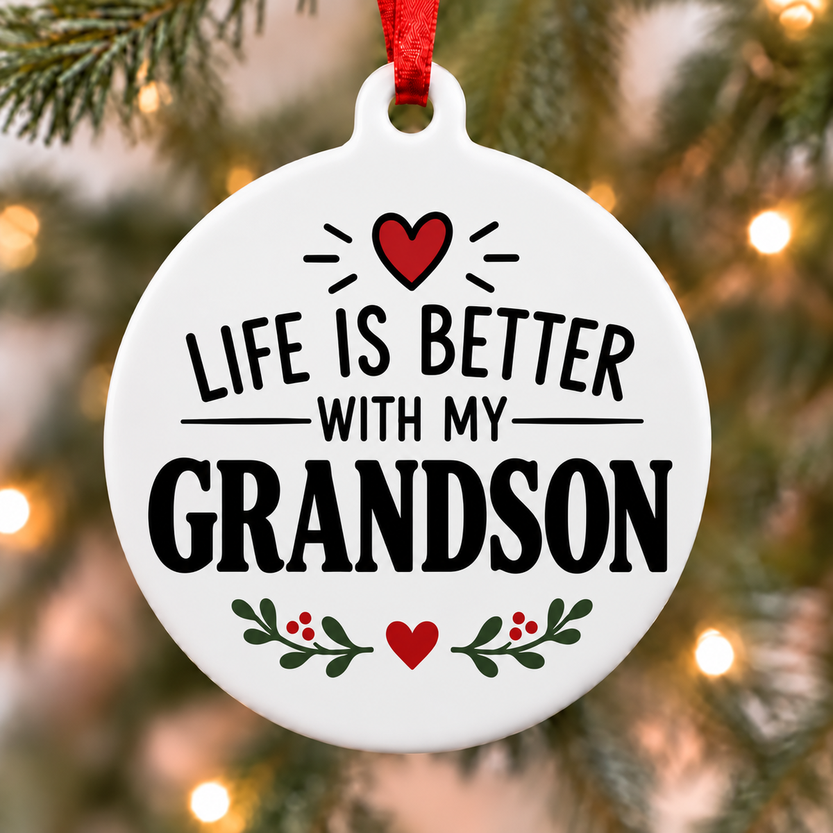 Life Is Better With My Grandson white PVC Christmas ornament close up on a tree with red ribbon