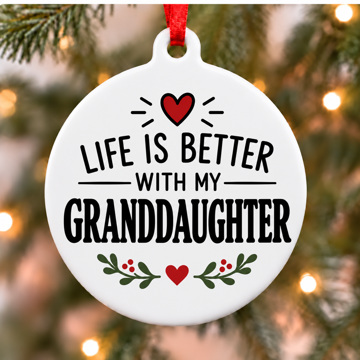 Life Is Better With My Granddaughter white PVC Christmas ornament close up on a tree with red ribbon