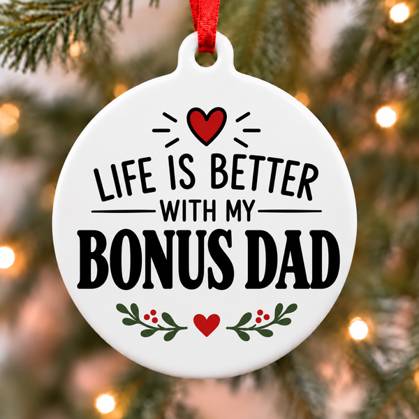 Life Is Better With My Bonus Dad white PVC Christmas ornament close up on a tree with red ribbon