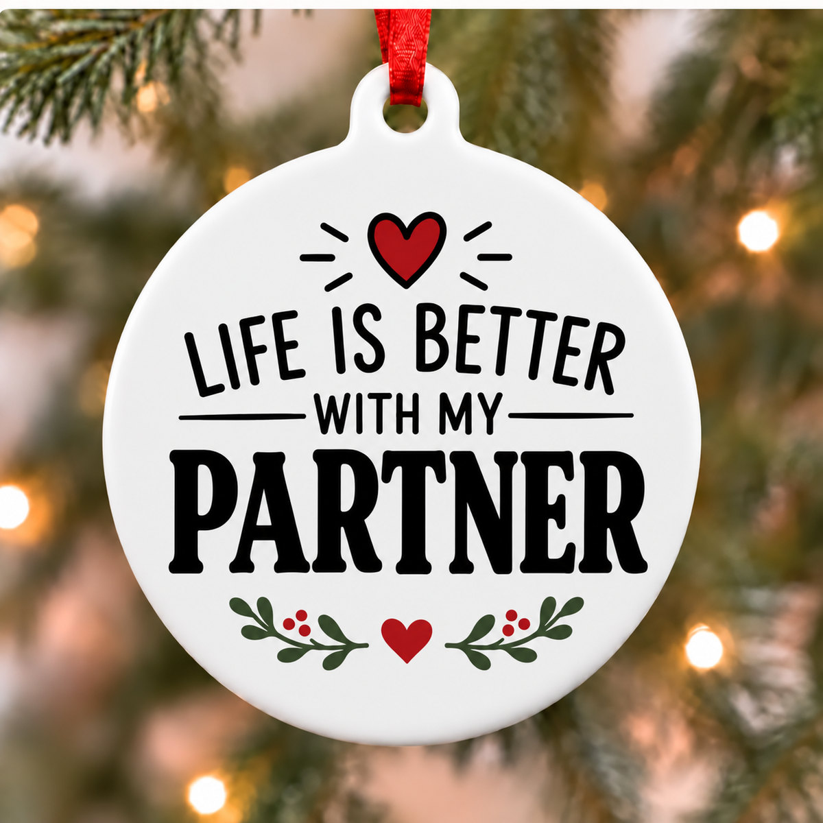 Life Is Better With My Partner white PVC Christmas ornament close up on a tree with red ribbon