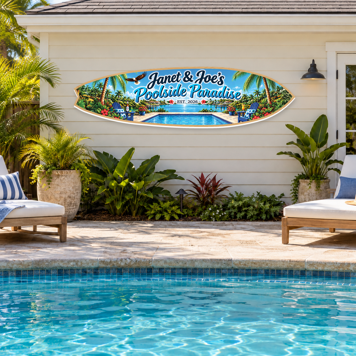 Janet and Joe’s Poolside Paradise personalized horizontal surfboard sign mounted outside on a pool house wall beside a swimming pool.